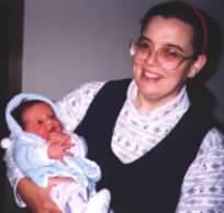 Linda holds her baby